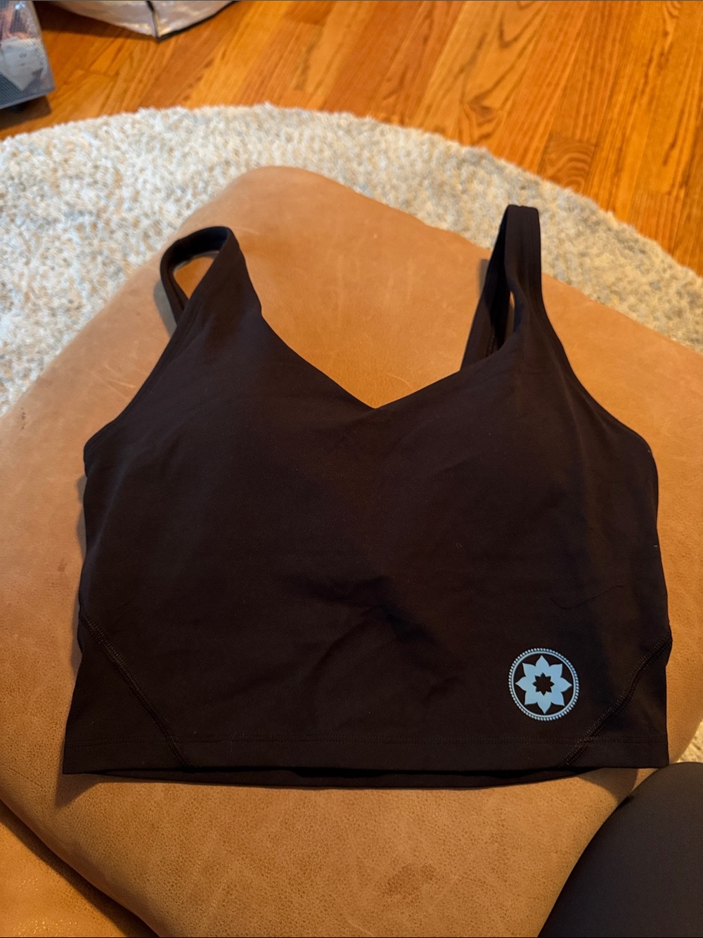 V-Neck Black Sports Bra with Subtle Star Logo